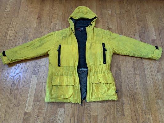 This is the coat which was in Like New Condition, a brilliant yellow before the  gray lining bleed all over it and turned it a green gray .