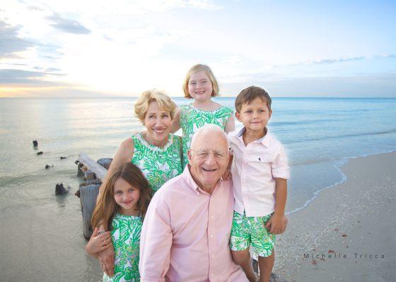 Extended Family portrait on Naples Beach. Proud grandparents w grandchildren. Michelle Tricca Photography