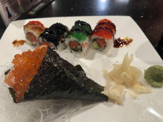 Colorful roll. Salmon hand roll with ikura