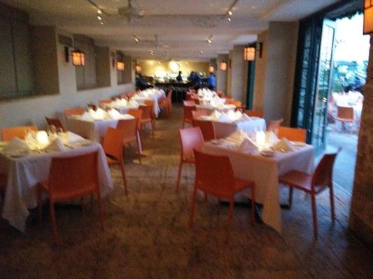 Indoor dining room, complete with orange plastic chairs