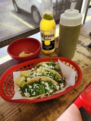 3 ground beef tacos add cheese, green sauce and a corona.. Perfection!