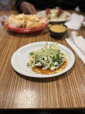 Fried Alaskan pollock taco topped with slaw