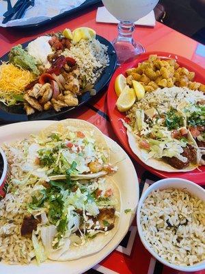 Grilled Mahi-Mahi, Grilled Shrimp, Fried Shrimp, Fried Mahi-Mahi and Chicken Fajita plates, all with cilantro rice.