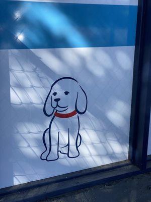 Cute pup illustration in the window