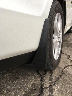 Mud Flap falling off a new bumper as a result of poor installation.