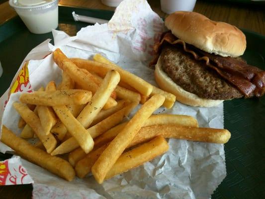 Homemade burger with bacon and fries