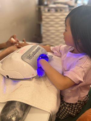 My 6 yr old getting her first gel manicure