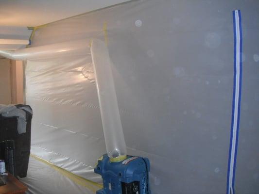 We set a containment and using a HEPA air scrubber we filter the air to the ouside of the home