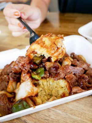 Mofongo topped with pepper steak.