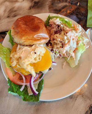 S.A.R. Burger (Angus beef, fried calamari, lettuce, onion, tomato, aioli) with coleslaw