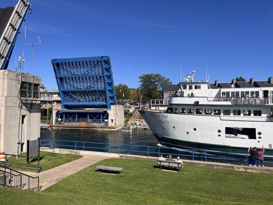 Island ferry headed out under the raised bridge