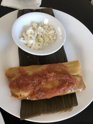 Chicken Tamale.masa so flavorful and the red sauce on top made my taste buds holler