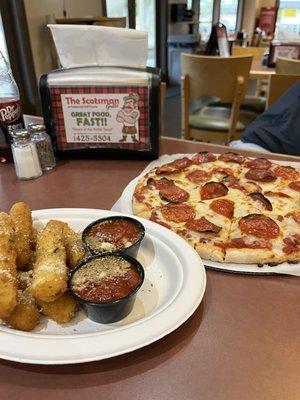 Low carb cauliflower pizza and full carb mozzarella sticks lol