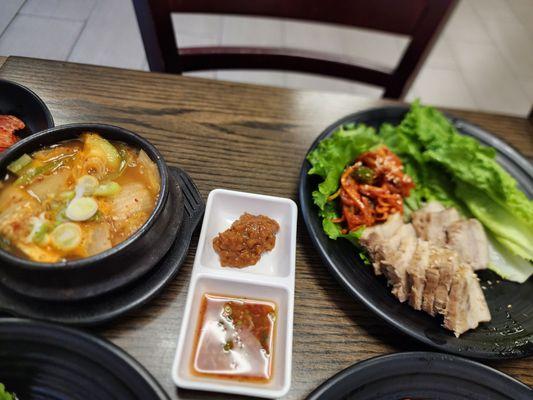 Pork with lettuce wrap. The menu item is Napa with pork. Ssamjang, dipping sauce, radish kimchi. Tofu stew.