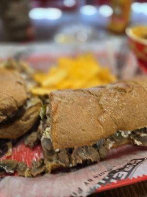 Steak and Cheese Sub with mushrooms and jalapeños.