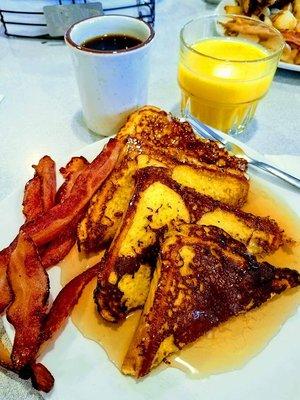 Delicious Texas French toast made with their secret recipe along with hickory smoked bacon!