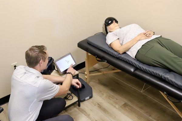 Wichita chiropractor monitoring patient