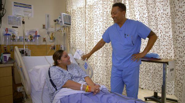 Dr. Bernie Hanna chatting with patient getting ready for gastric sleeve surgery