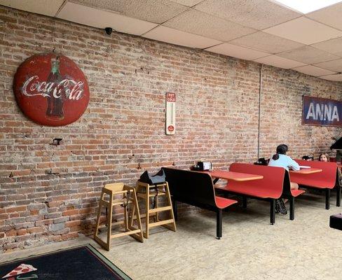 Seating area. Love the old brick wall.