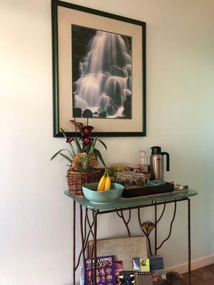 Tea and fruit table in waiting room.