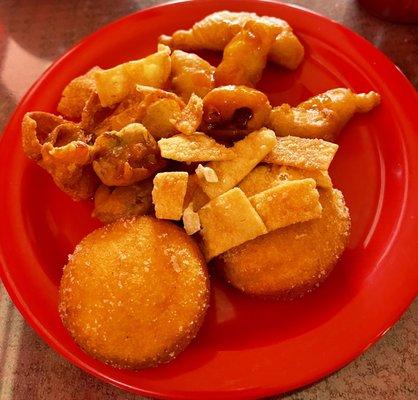 Fried doughnuts, fried wontons, Crab Rangoon, and fried chicken.