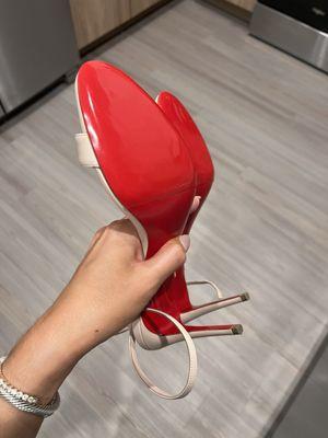 Louboutin heels with protective cover on bottom (worn a couple times before this picture was taken)