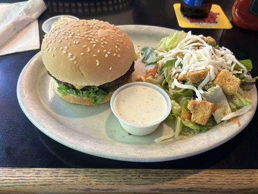 Burger with a side salad