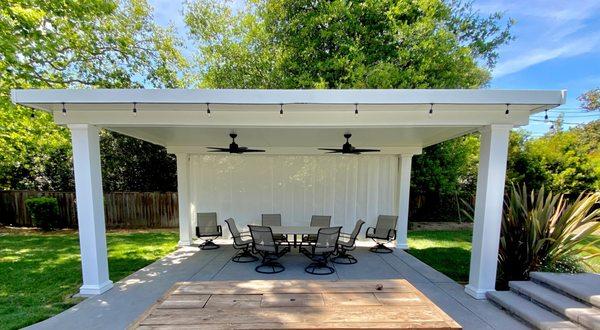 Solid Patio cover, with electrical and curtain.