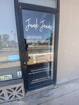 Store front door with vinyl sign installed by Davconn.