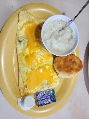 Veggie omelette with biscuit and grits.