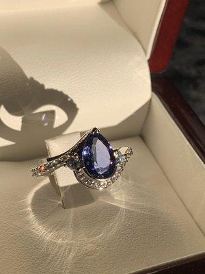 My custom designed engagement/wedding ring - tanzanite is the stone in the middle.