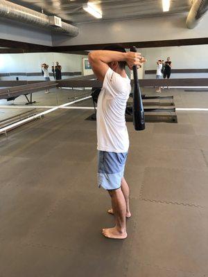 One of my clients andrew kao working on a specific exercise call the swipes to strengthen his posterior chain, glutes, lats, hamstrings.