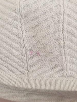 How did this mysterious pink dot get on my favorite white sweater