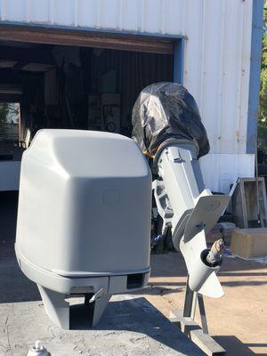 Mercury outboard motor restoration. This picture is showing the motor with primer and ready for paint.