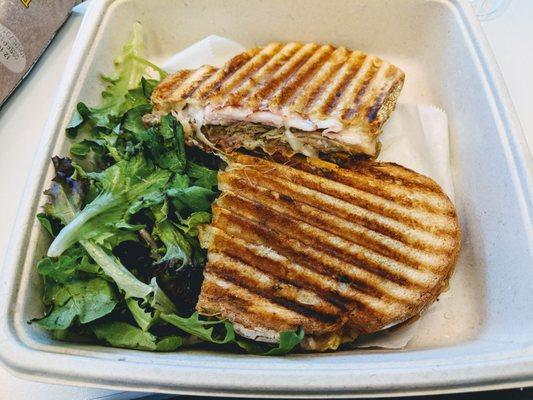 Cubano Panini - slow roasted soffrito pork, black forest ham, crisp dill pickle, baby swiss, yellow mustard, and roasted garlic aïoli.