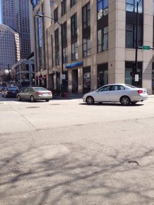 Citibank inconveniently located on the corner of Oak and State, no parking provided for bank customers.