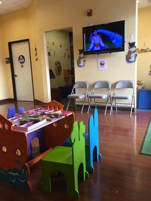 Here at children's dental center watching a movie while waiting and being kept company by Jacqueline and Maggie.