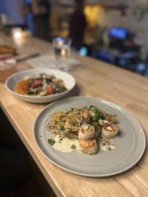 Scallops over risotto pancakes with carmelized spaghetti squash