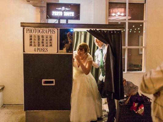 Spilling out of the vintage photobooth in laughter. This thing was the HIGHLIGHT of my wedding reception. (Photography by Apollo Fotografie)