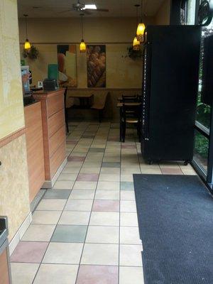 pic taken at drink station. counter is down around the left side. Entrance is on the right by the floor mat