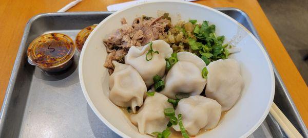 Half and half dumplings and noodles with pork.. amazing good!