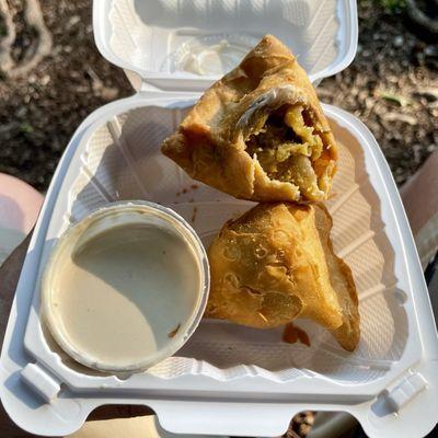 Huge over-stuffed lightly-spiced veggie samosas with smooth nutty sesame-tahini sauce!