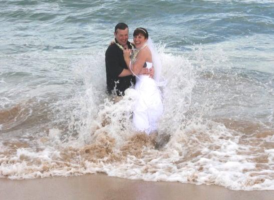 Jen Trashes The Dress In The Maui Sea at A Happy Maui Wedding. Photo by Jeff Bond.