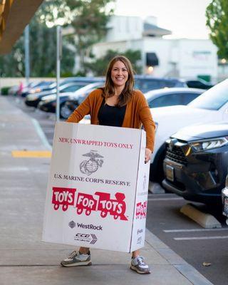 Our Broker Stephanie had to break out the big guns to carry out a FULL box of Toys for Tots donations!