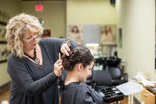 Jan working her "up do" magic Photo credit: Marianne Sabrier