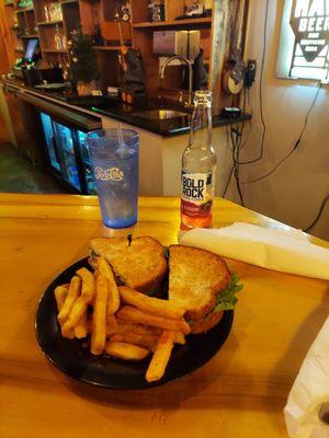 Blackberry cider and chicken sandwhich with fries