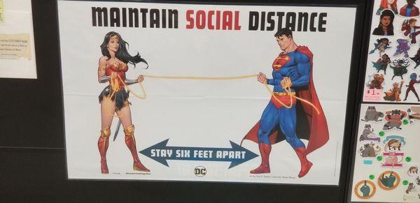 Coolest social distancing poster ever! They also have a Batman and Robin social distancing poster on the door, but it's faded.