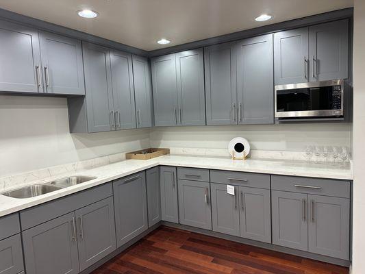 Galaxy white quartz countertop with gray shaker cabinets