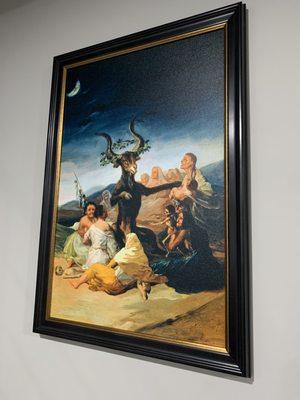 "The Witches Sabbath" by Francisco Goya in a custom frame.