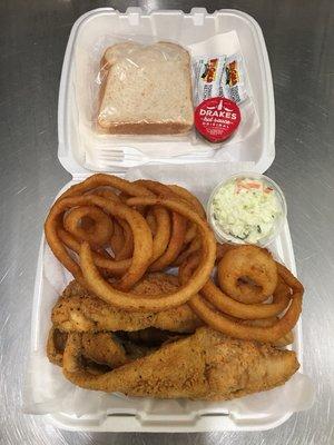 Wild caught Argentinian Whiting dinner accompanied by onion rings and coleslaw